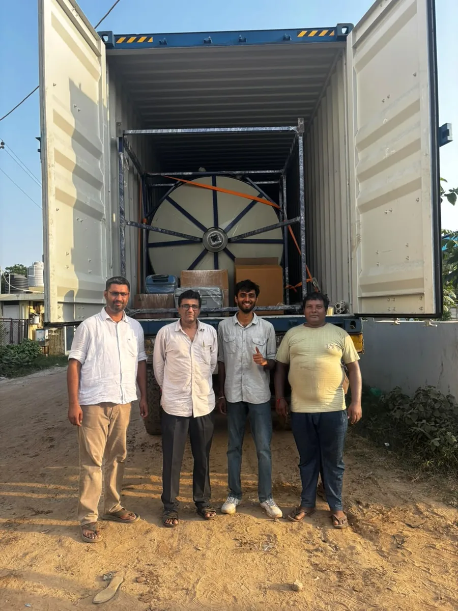 The NMECH team with a completed tank loaded into a shipping container for export