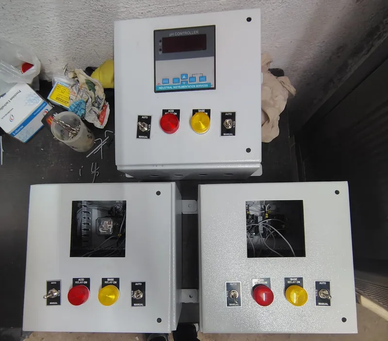 pH controller panels with acid and base dosing relays, built for effluent neutralisation