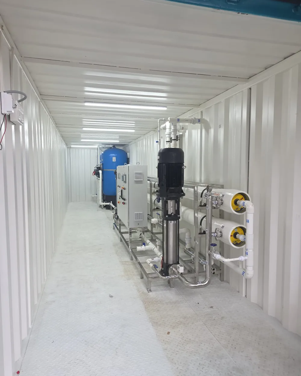 Containerised reverse osmosis plant built by NMECH Engineering, with membrane housings and high pressure pump